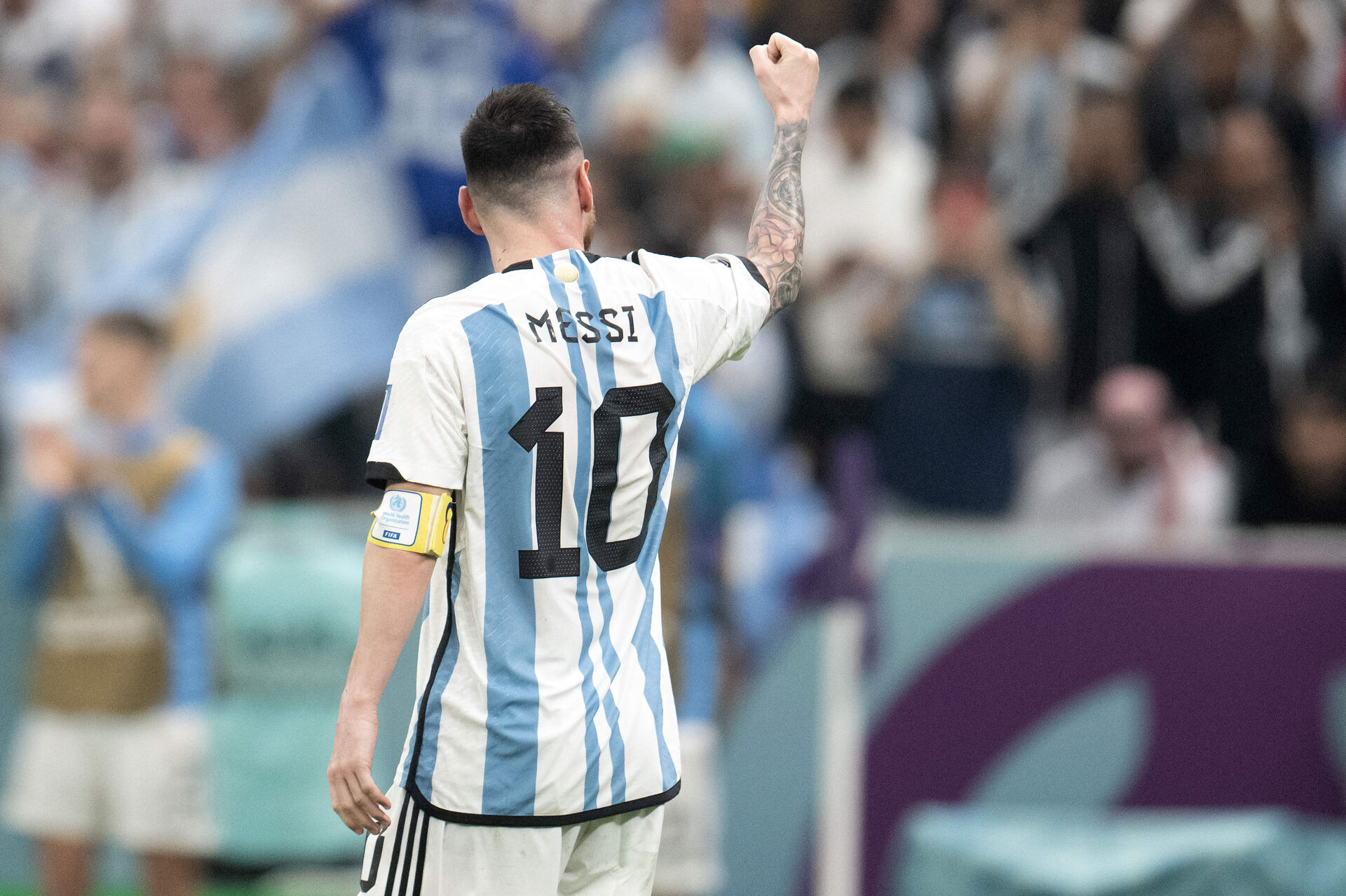 Football player celebrating with raised fist